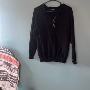 Black sweater with ruffle collar